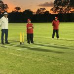 Beep Cricket at night for the first time. In the photo from left to right are Bill Hensen (umpire), Karen Carpenter (bowler), and Paul Szep (observer). Karren, a member of the Dragons team is ready to bowl the white beeping cricket ball.