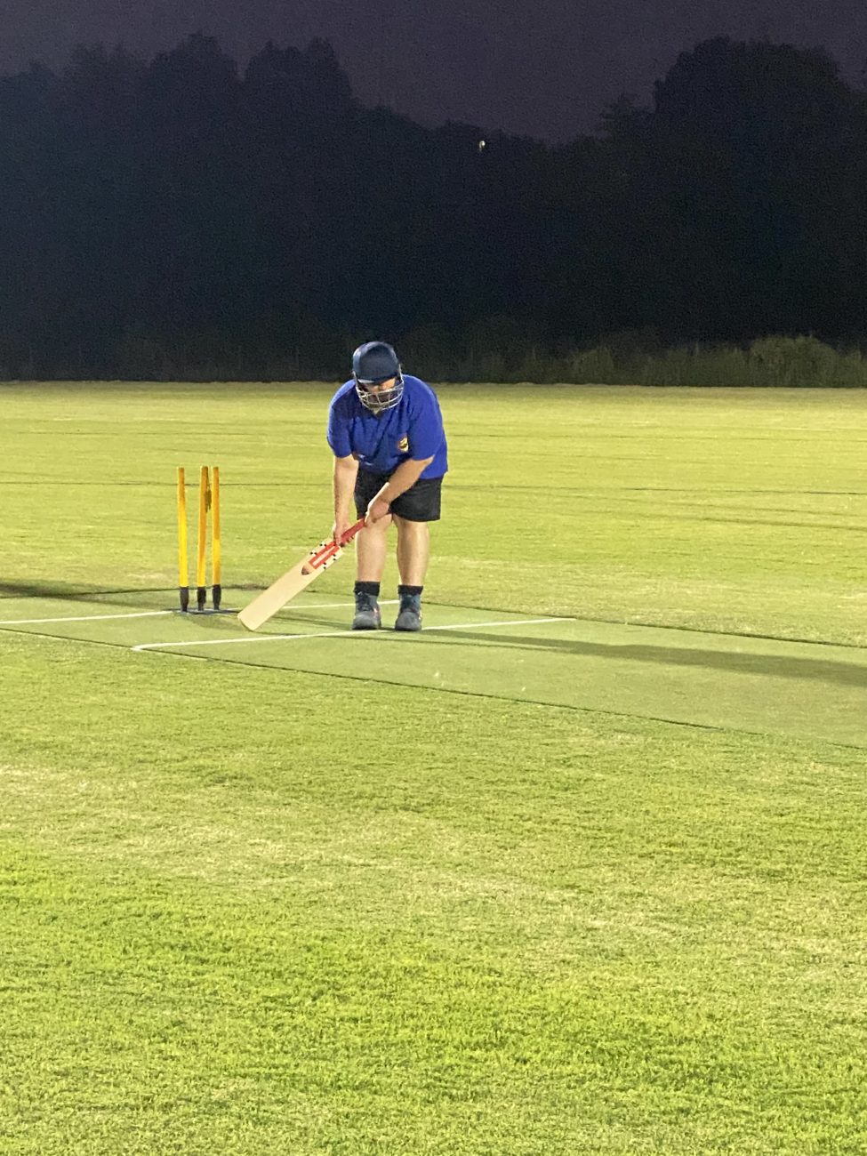 Blue Dolphin's batsman Brendon, listens closely to the beeing ball in readiness to hit through the fielders to the boundary.