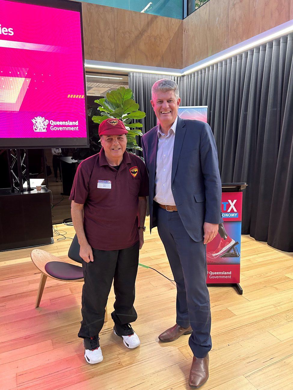 President Paul Szep and Sports Minister Stirling Hinchcliffe at SportX 2023. Paul wearing his Bats Uniform standing with Stirling in a suit.